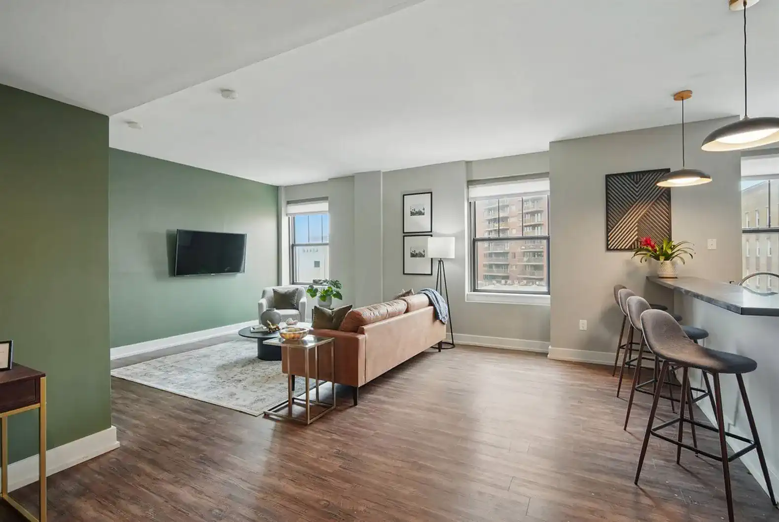 Open-concept living with natural light, cozy textures, and tasteful decor—an ideal space to unwind or entertain.