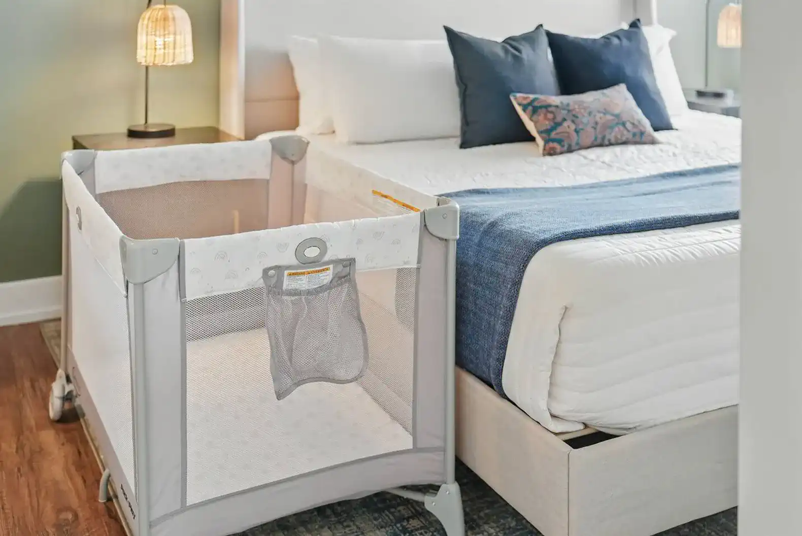 Traveling with a baby? A clean, comfy Pack ‘n Play is set up right next to the bed—perfect for keeping your little one close and secure.