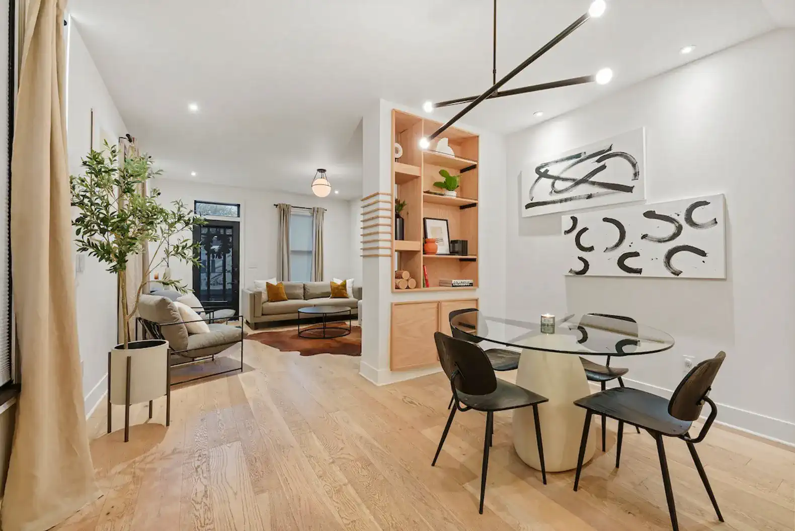 Stylish dining area with modern decor and a cozy living space