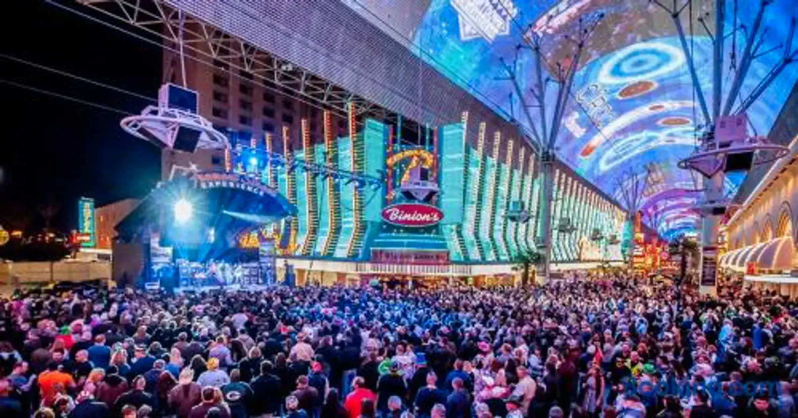 Vibrant nightlife scene with crowds and colorful lights in Las Vegas