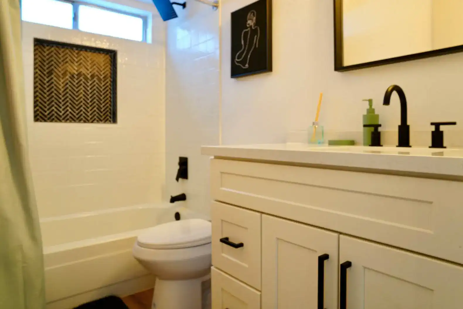 Modern bathroom featuring a bathtub, stylish sink, and contemporary fixtures