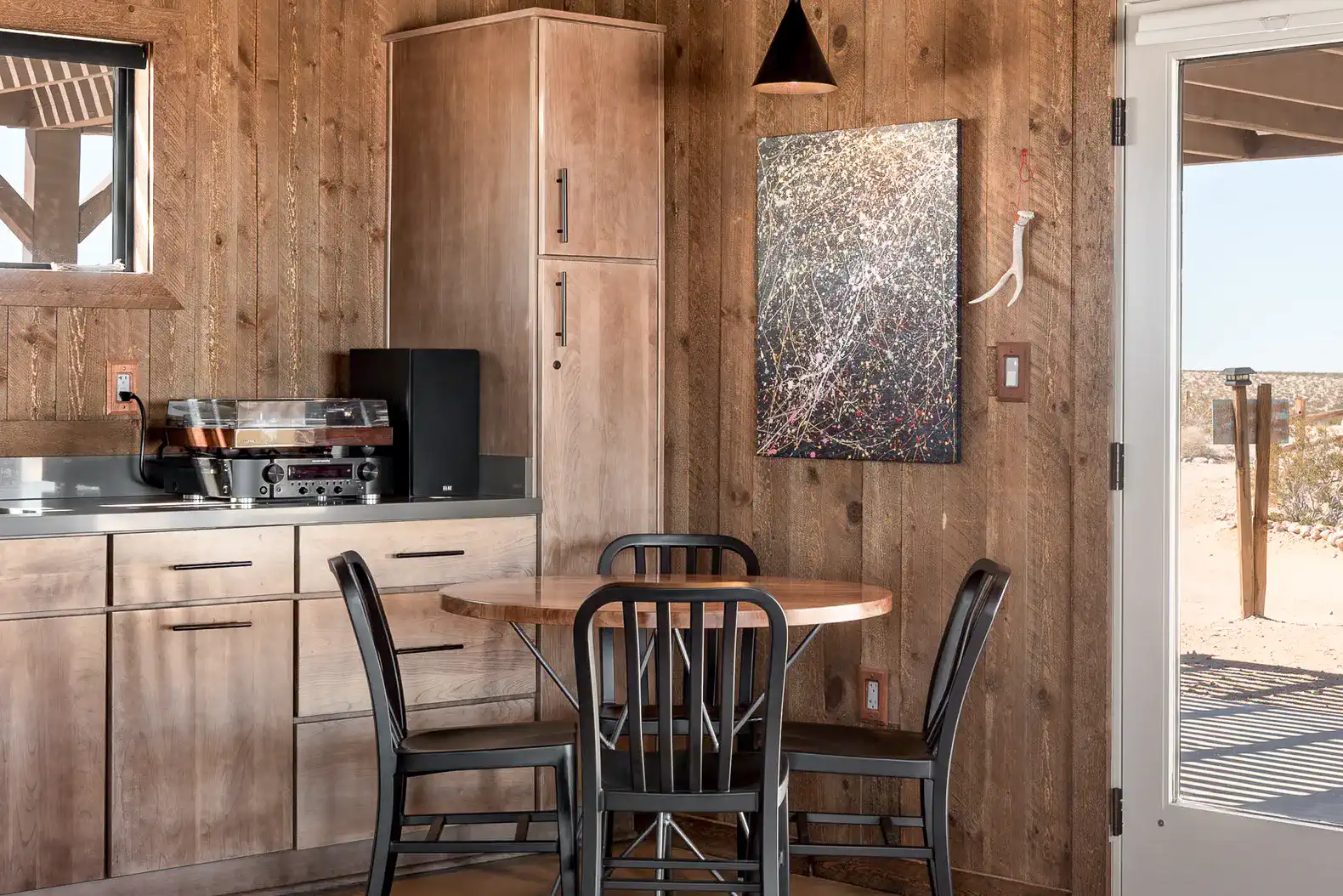 Cozy kitchen area with wooden cabinets and a round dining table
