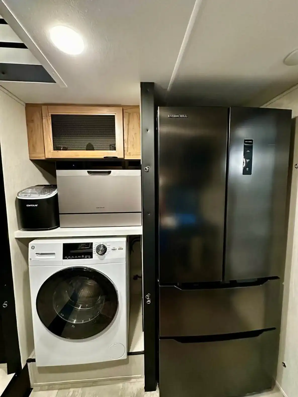 Full size refrigerator, Washer/Dryer combo & dishwasher.