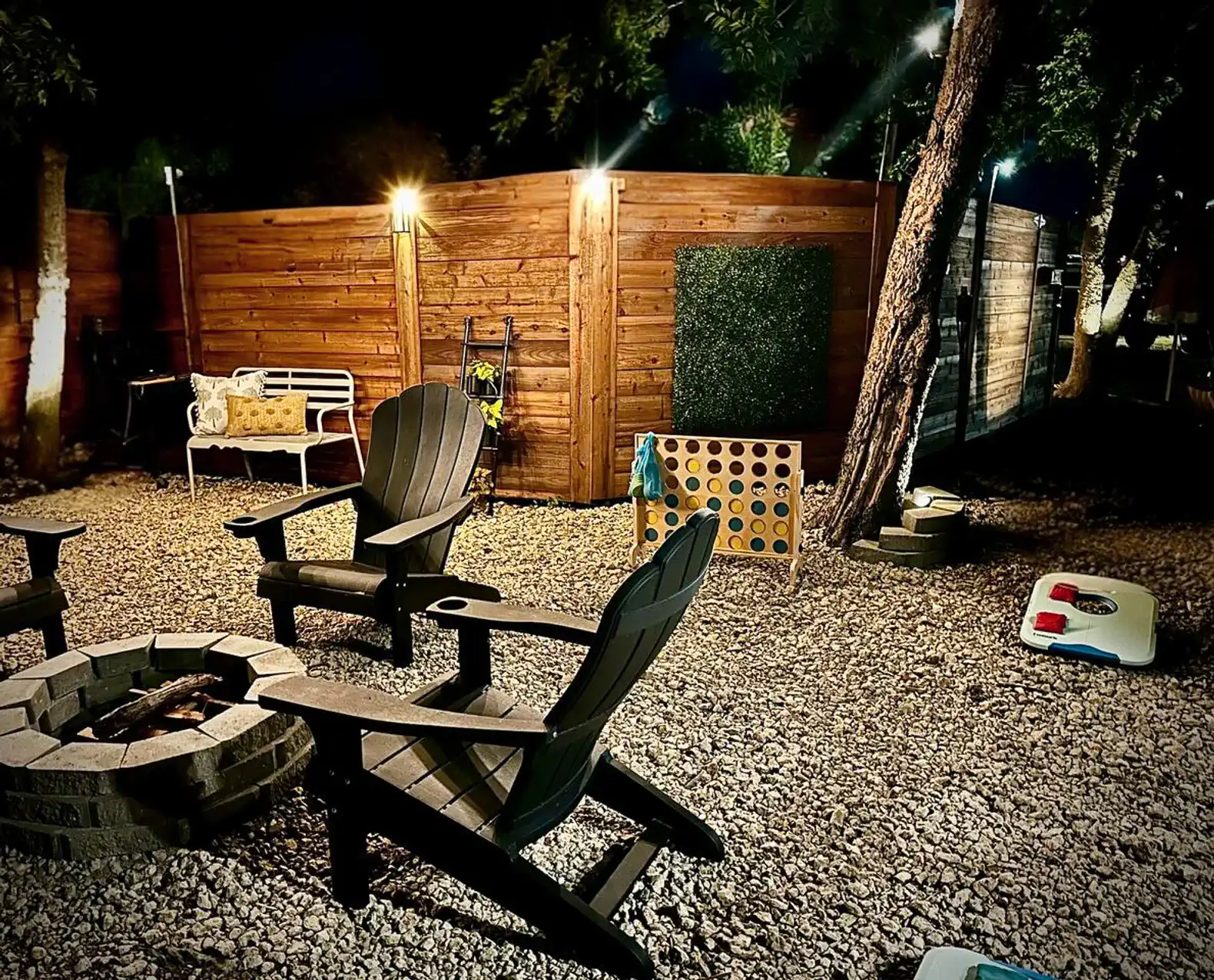Cozy outdoor seating area with fire pit and wooden fencing