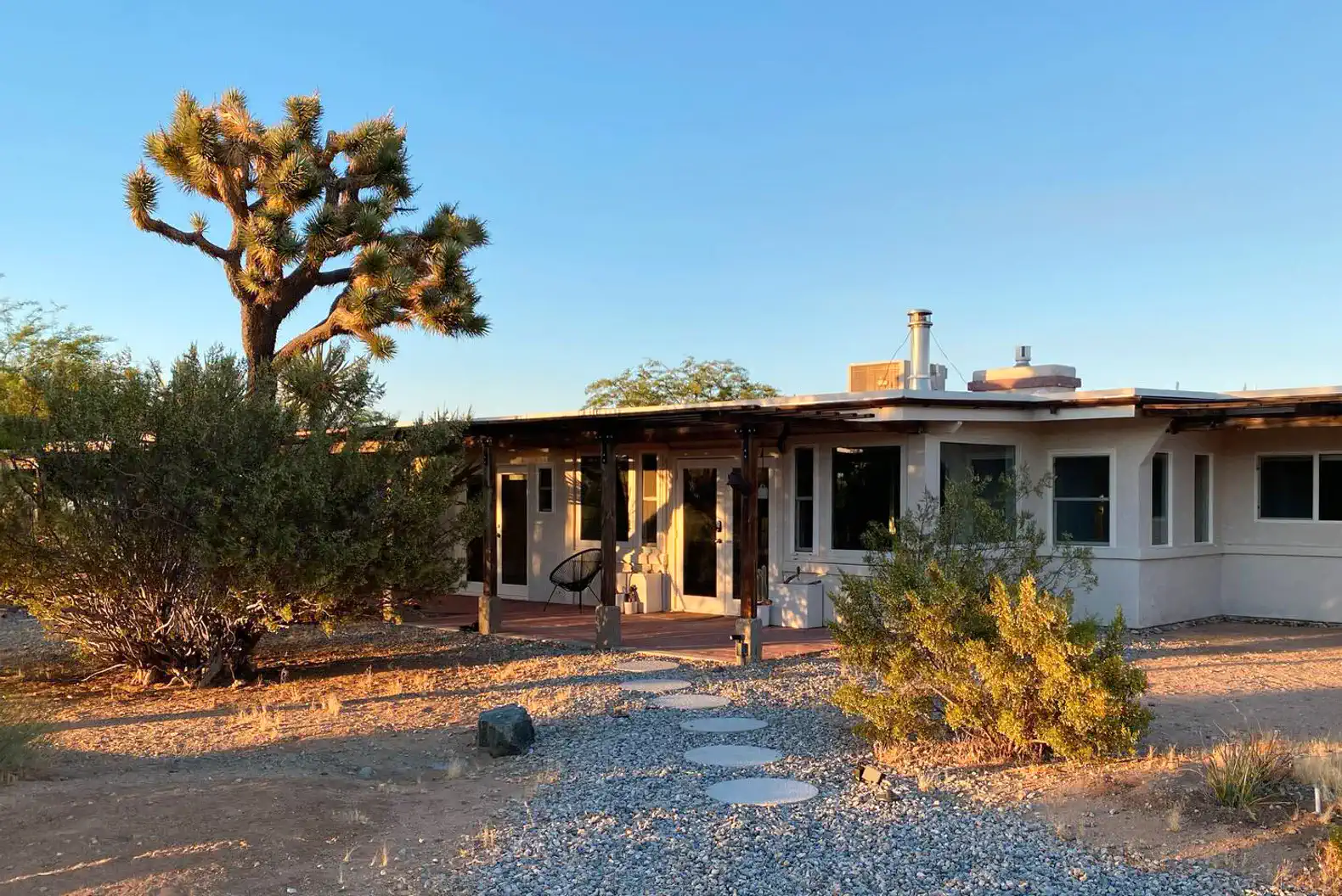 A Joshua Tree outside the covered front porch.