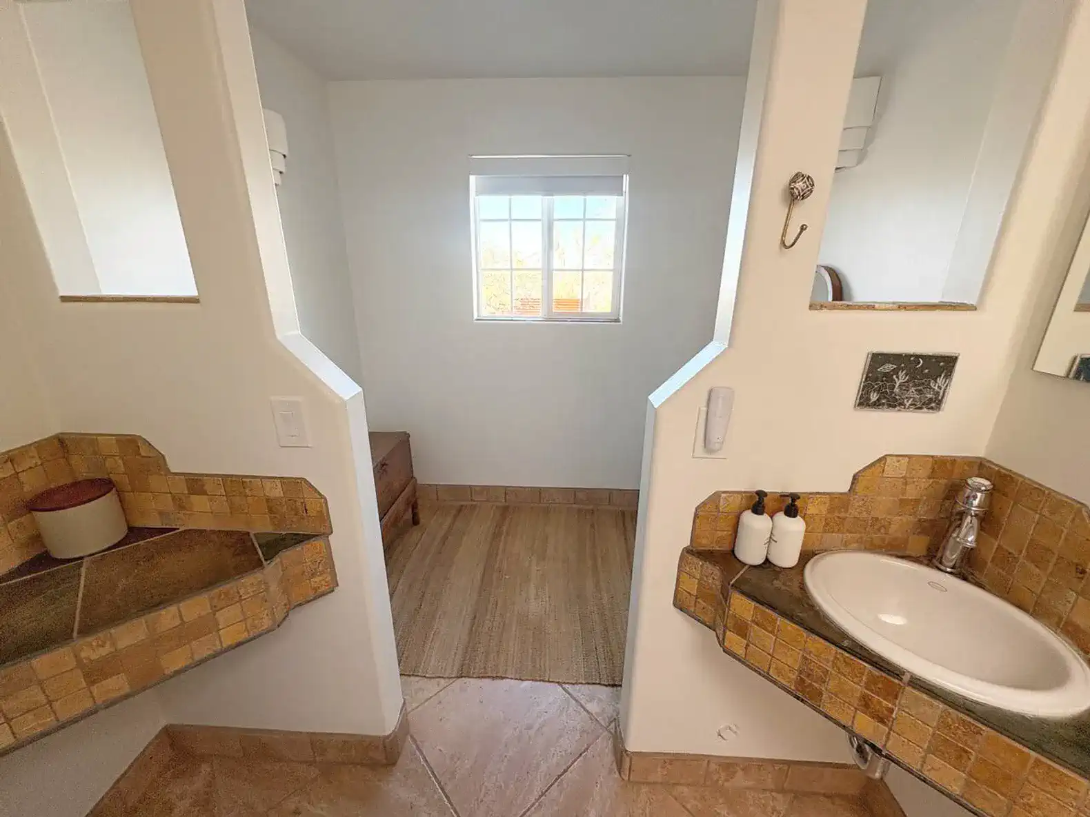Bright bathroom with dual sinks and natural light