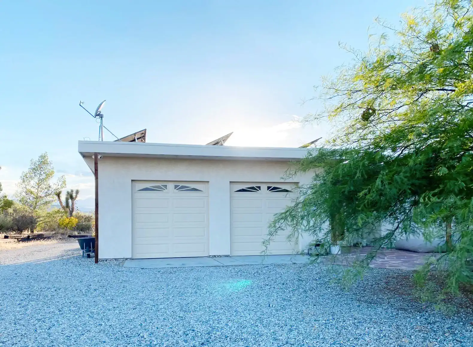A large two-car garage is available for guest use with free 240v EV charging (NEMA 10-30 outlet) and Tesla adapter.