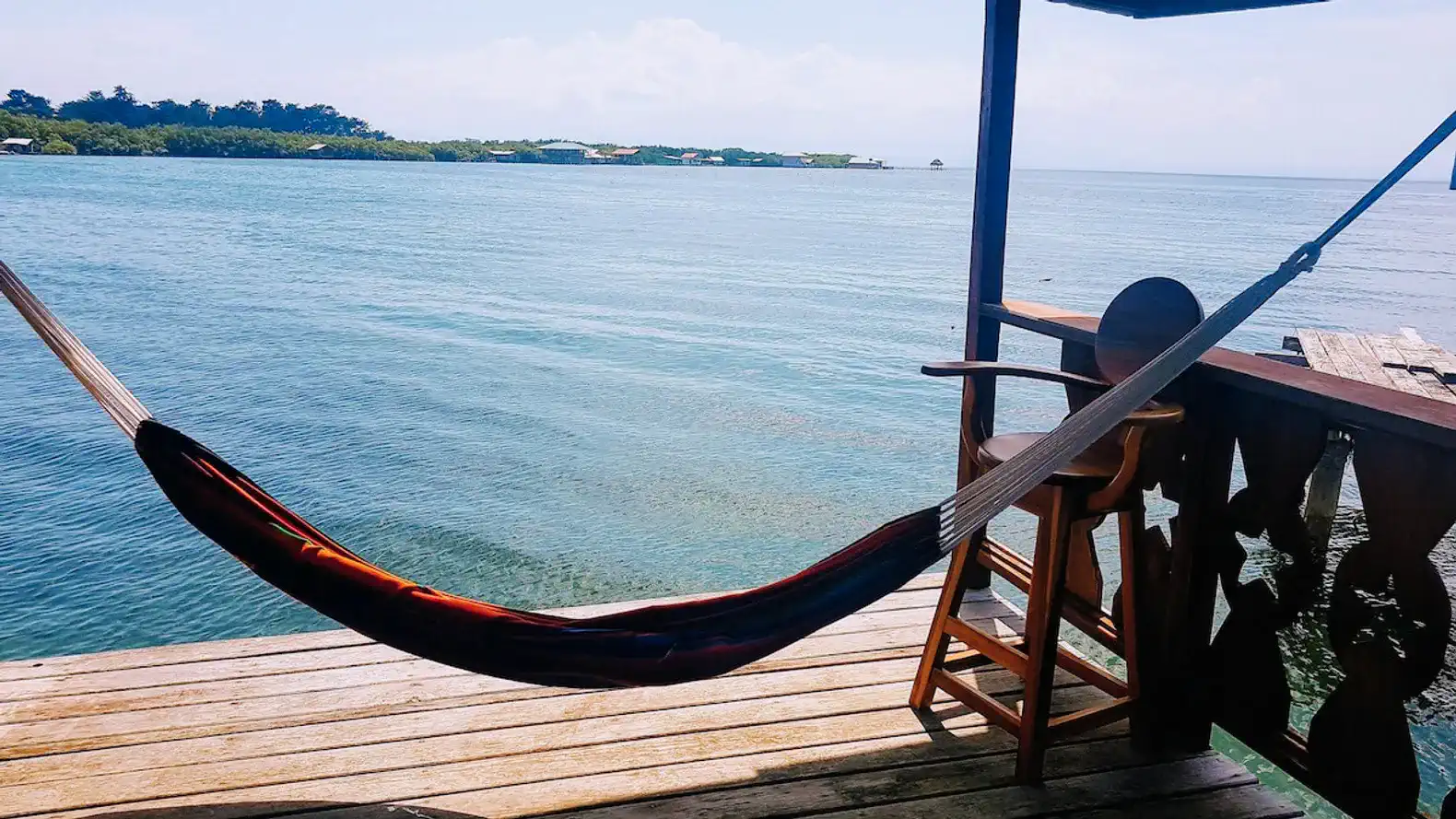 Hammock overlooking calm waters with a scenic view