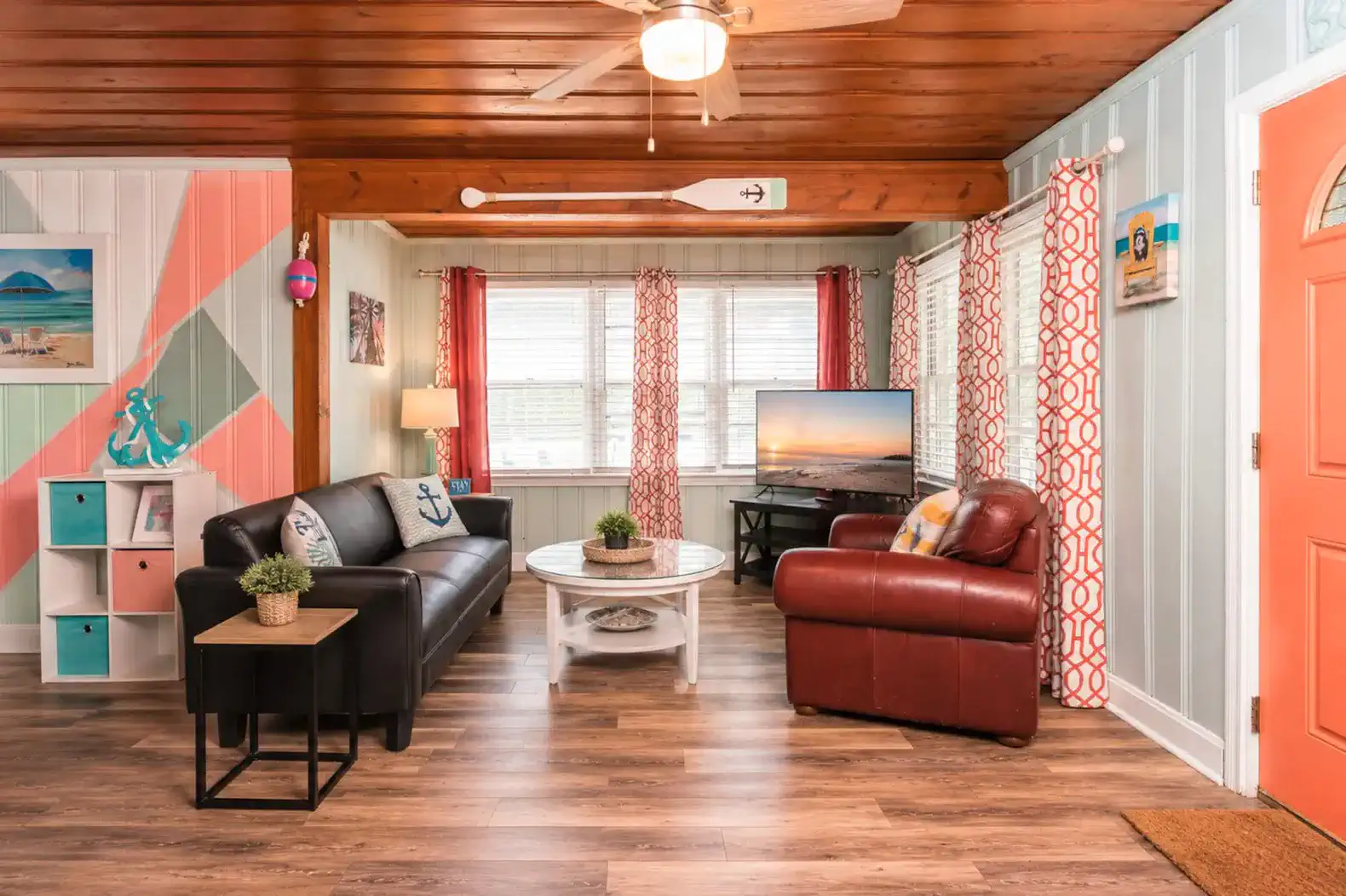 Cozy living room with a sofa, armchair, and colorful decor