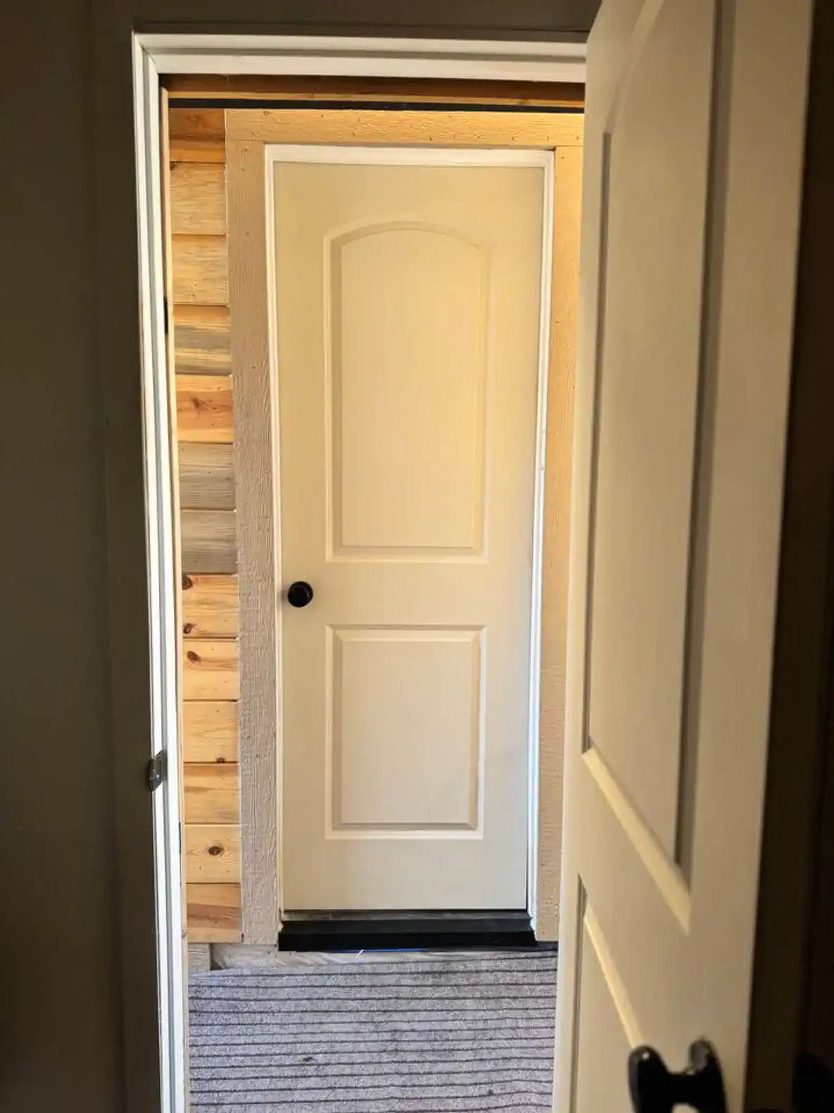 Looking at bedroom 2 door from bedroom 1