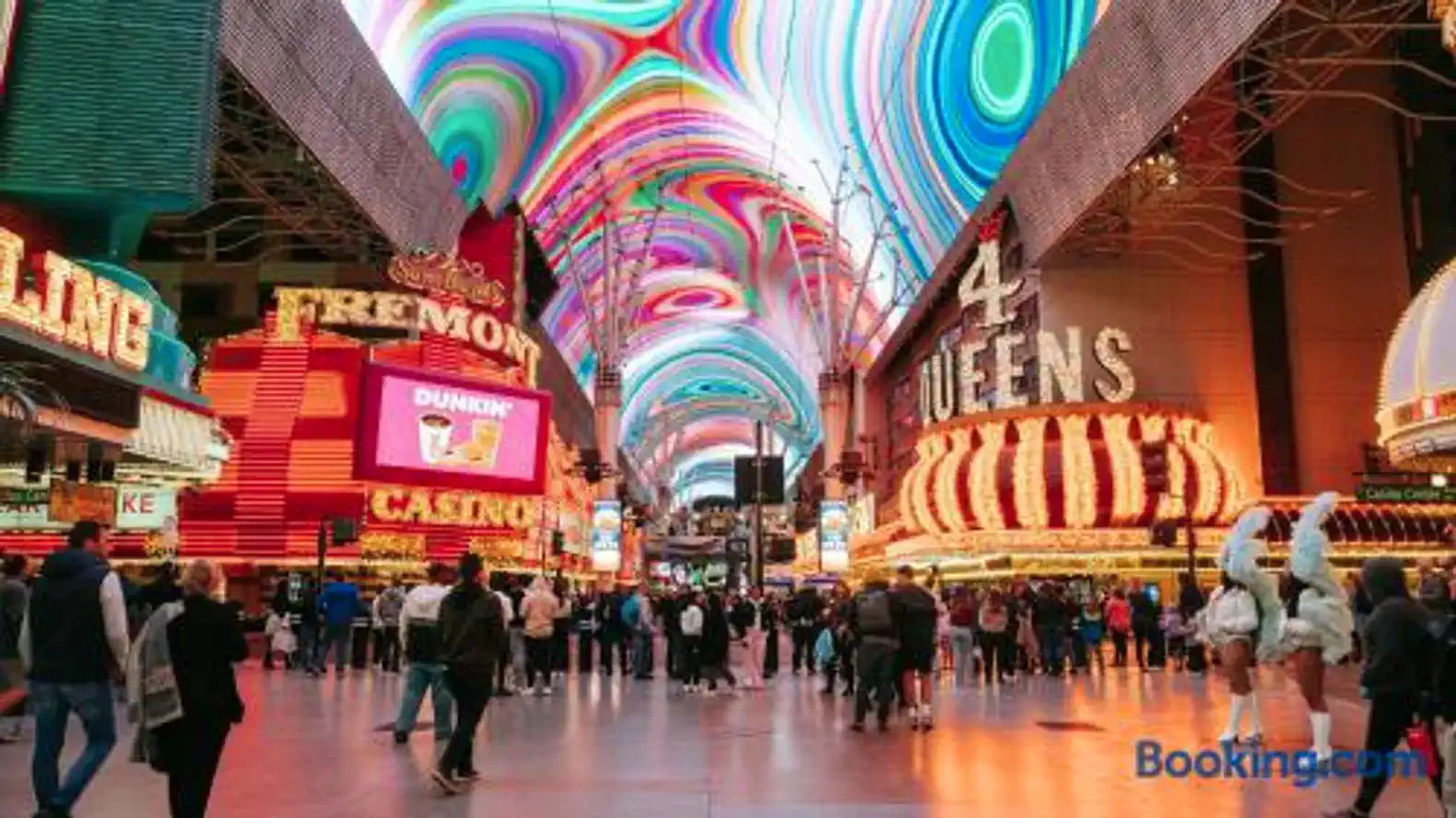 Vibrant Fremont Street with colorful lights and crowds enjoying the atmosphere