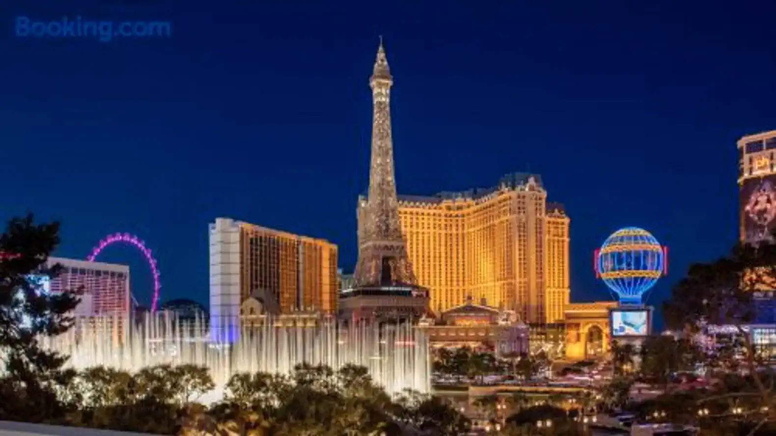 Illuminated Las Vegas Strip featuring iconic buildings and fountains at night