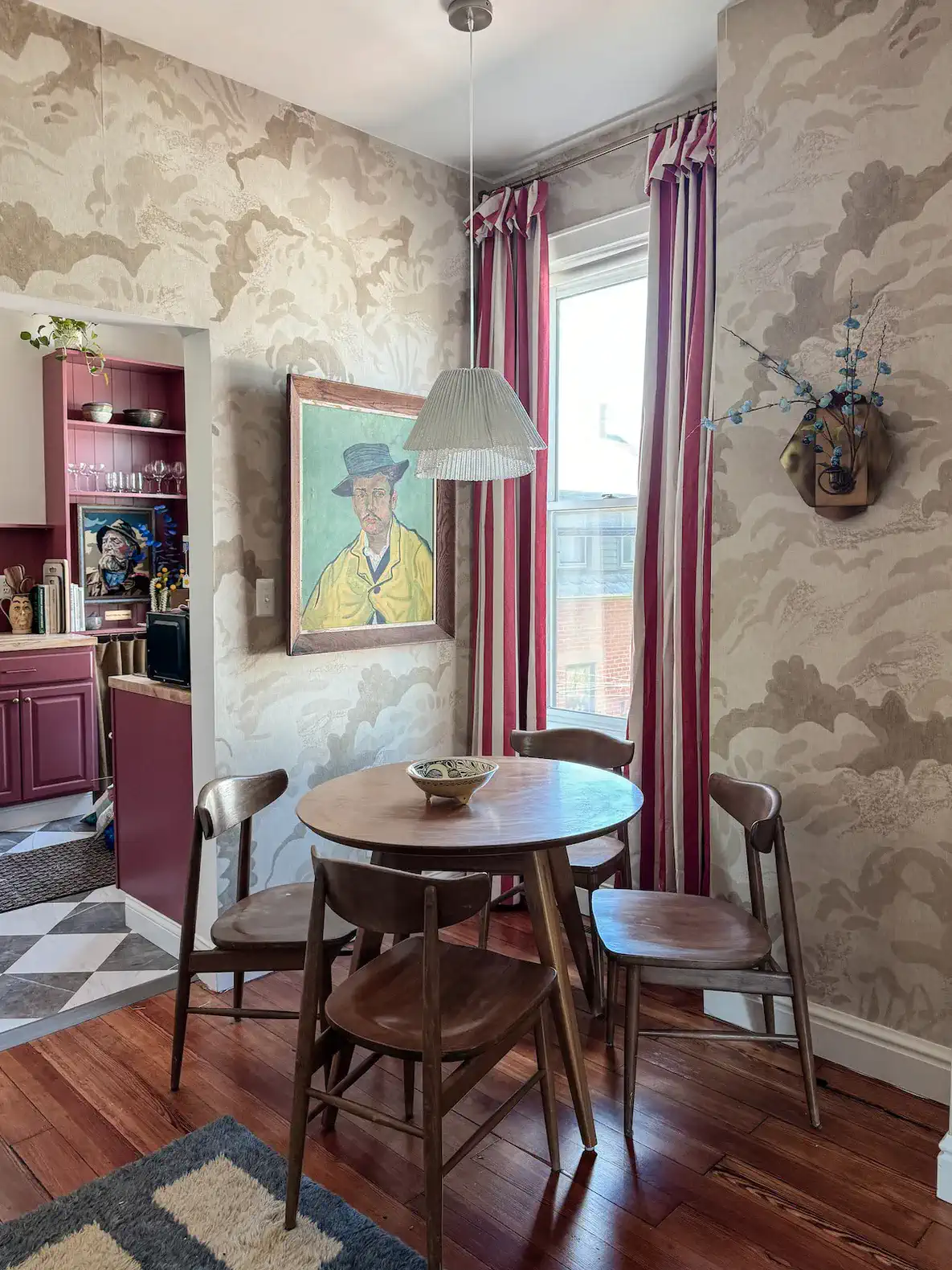 Cozy dining area with a round wooden table and vintage decor