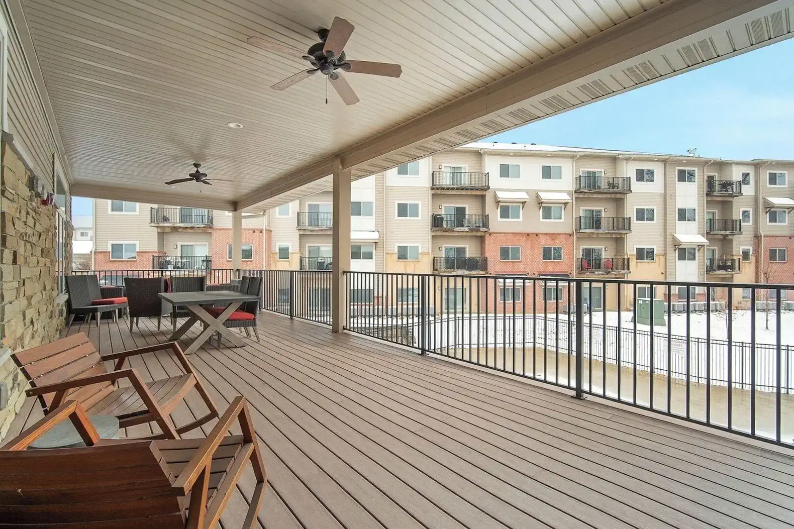 The covered deck/balcony at the clubhouse overlooks the pool area and is available for you to use, including the gas grill.