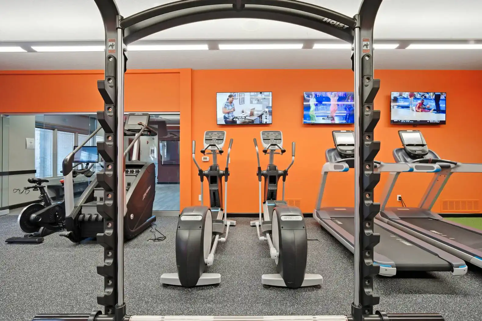 The onsite gym features commercial-grade cardio and strength equipment, rubber flooring, ceiling fans, and energizing natural light—perfect for maintaining your workout routine.