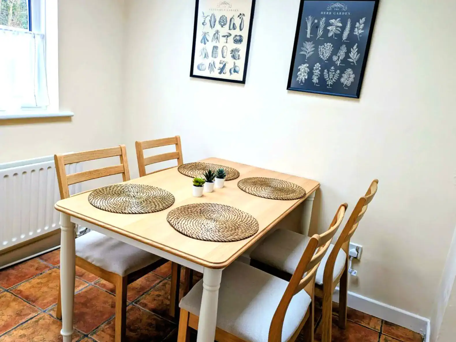Dining table brightened by skylight and window.