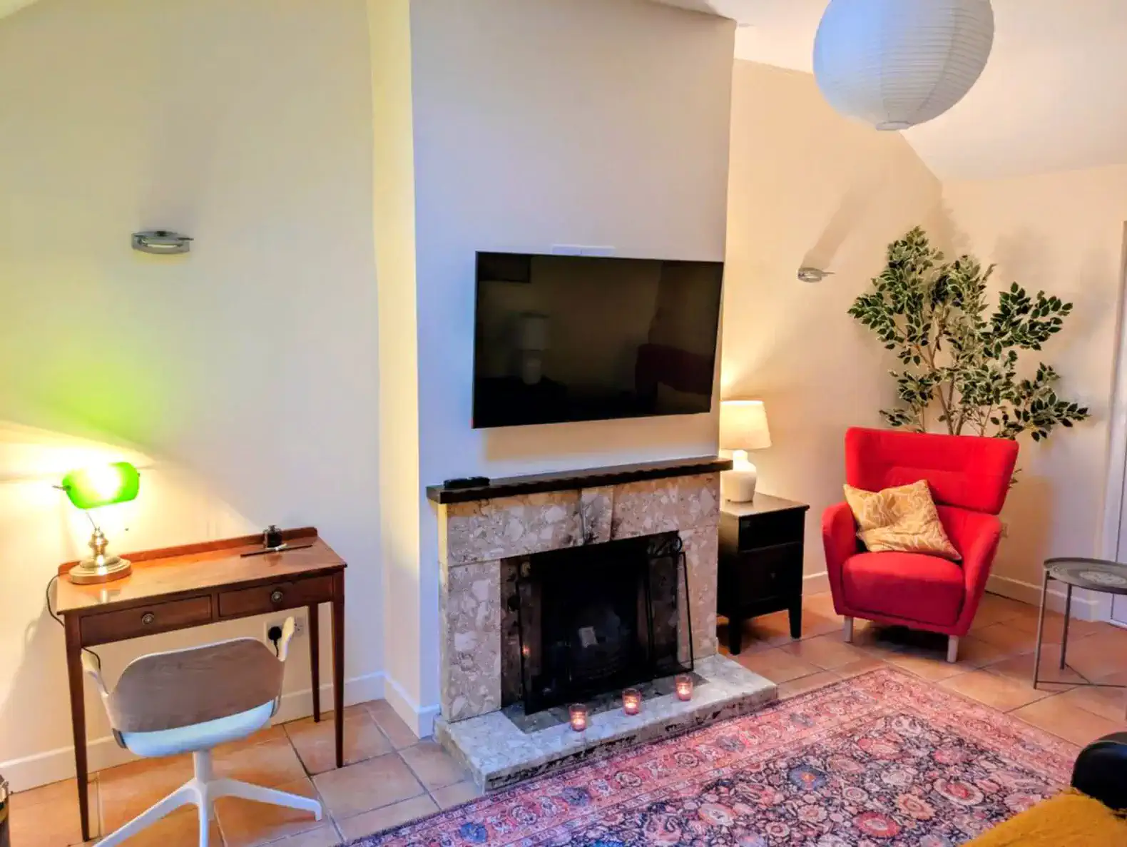 Cozy living room with a fireplace, TV, and comfortable seating