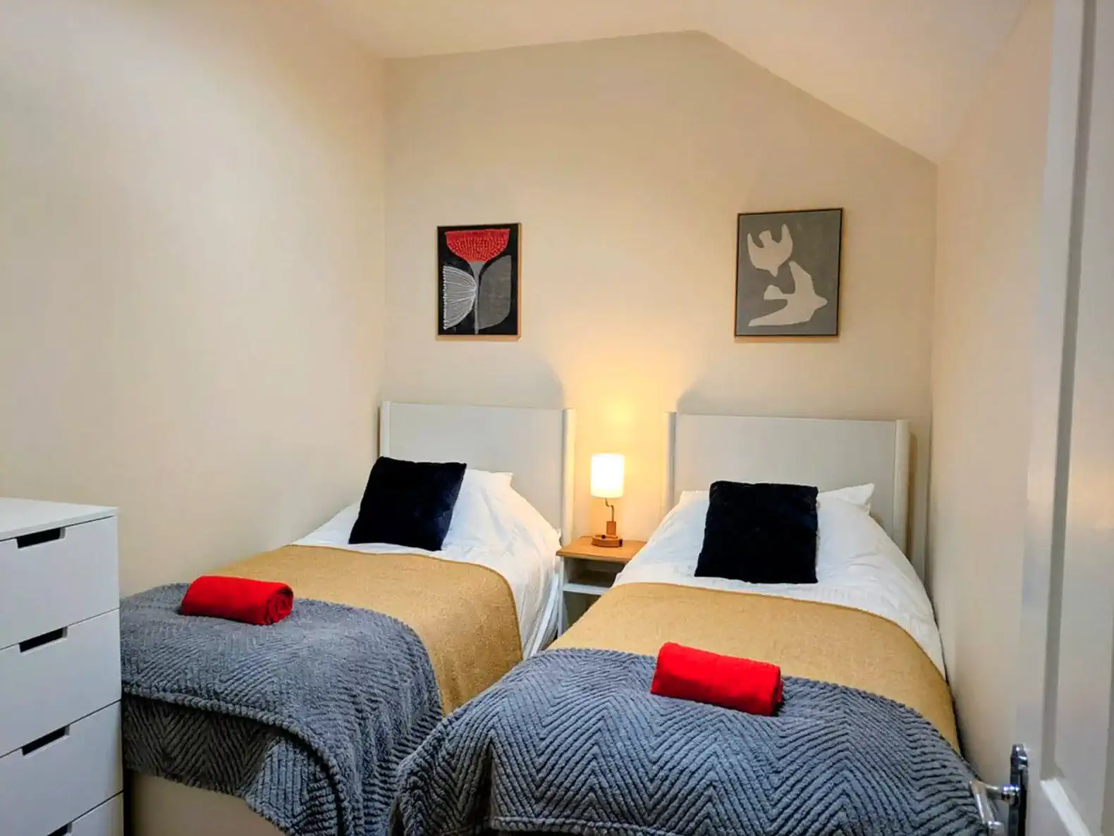 Cozy guest bedroom with two twin beds.