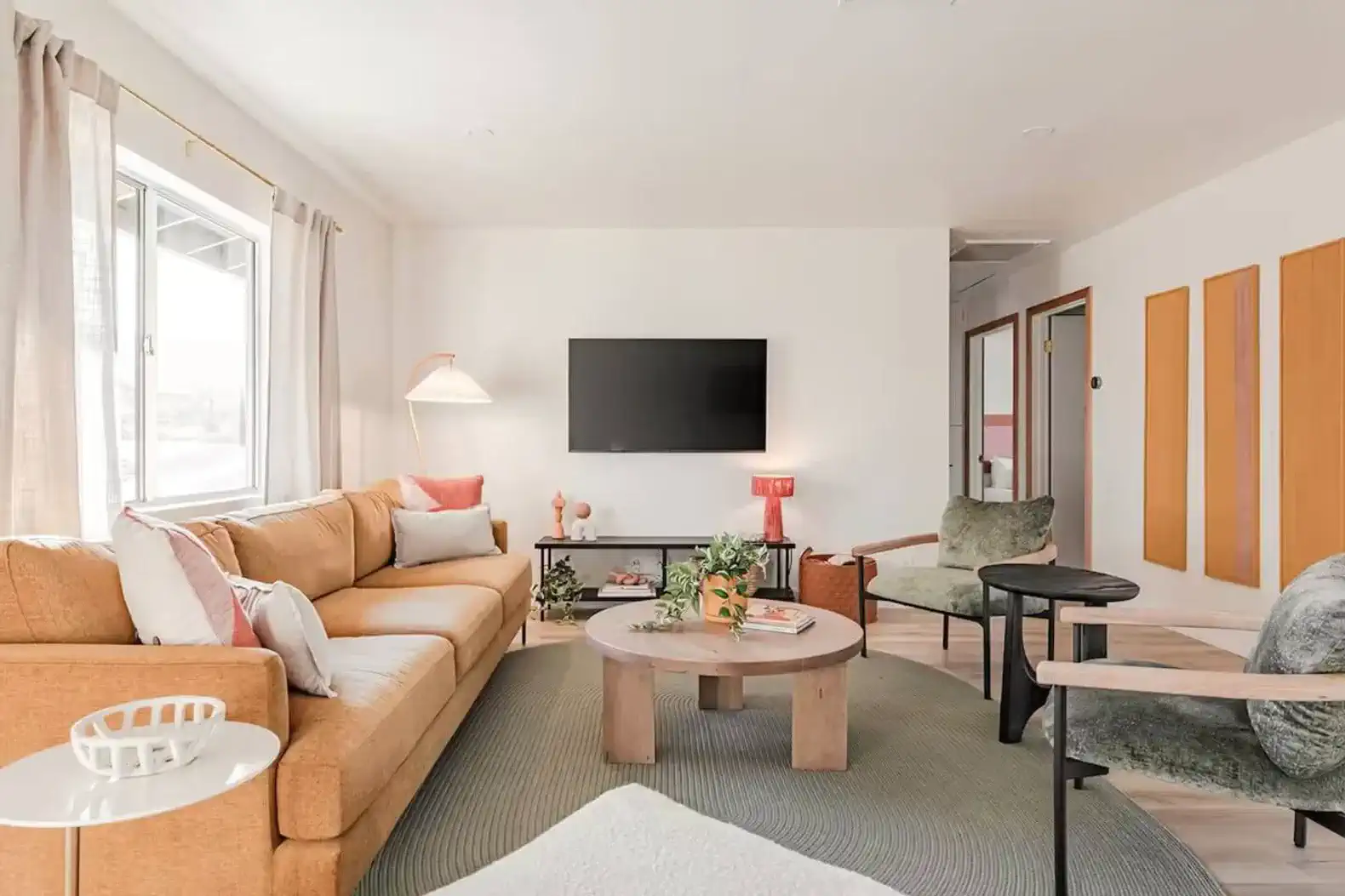 Cozy living room with a large sofa, coffee table, and modern decor