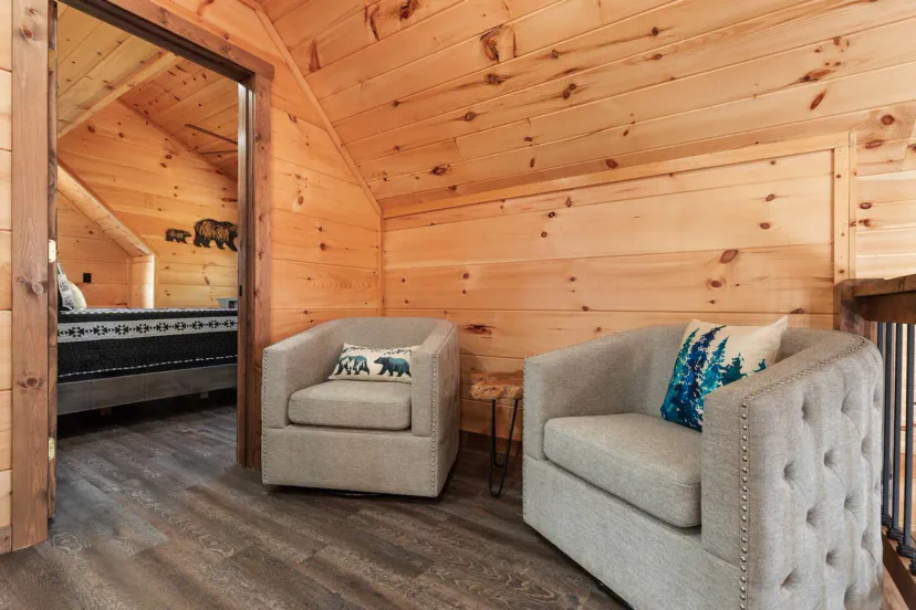 Cozy seating area with two armchairs and wooden accents