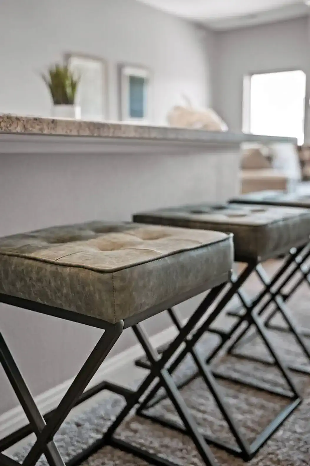 Bar-height seating at the kitchen counter offers a casual spot for morning coffee, quick meals, or conversation.