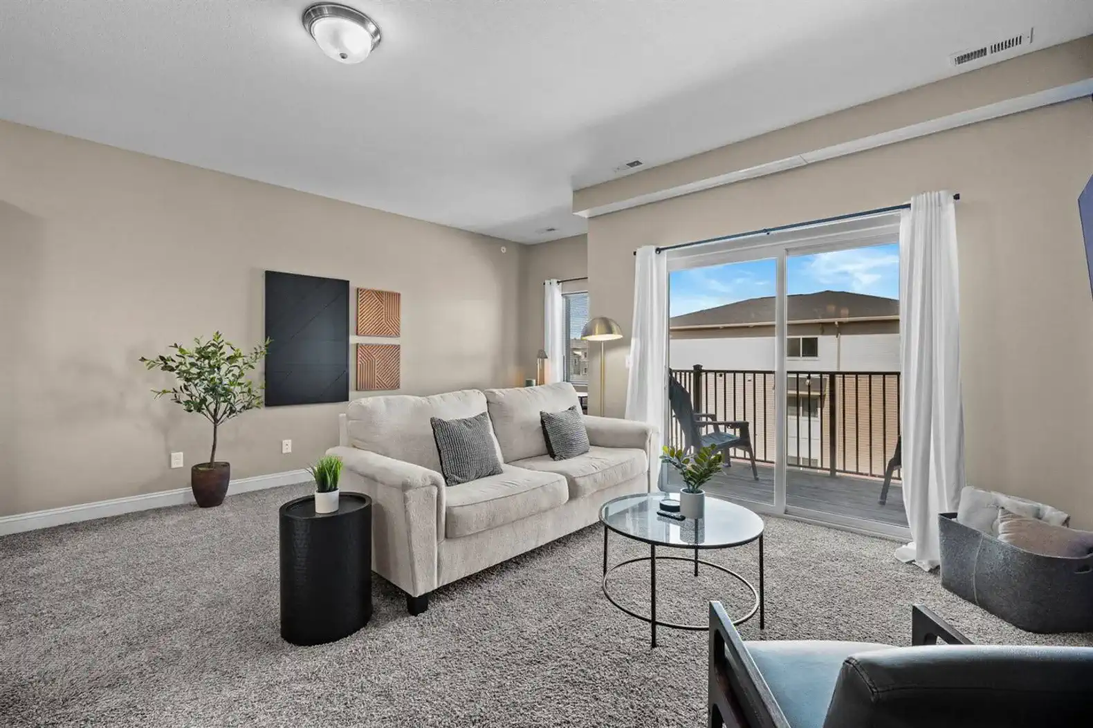 Escape to the private balcony, complete with seating, table, patio lights and more!