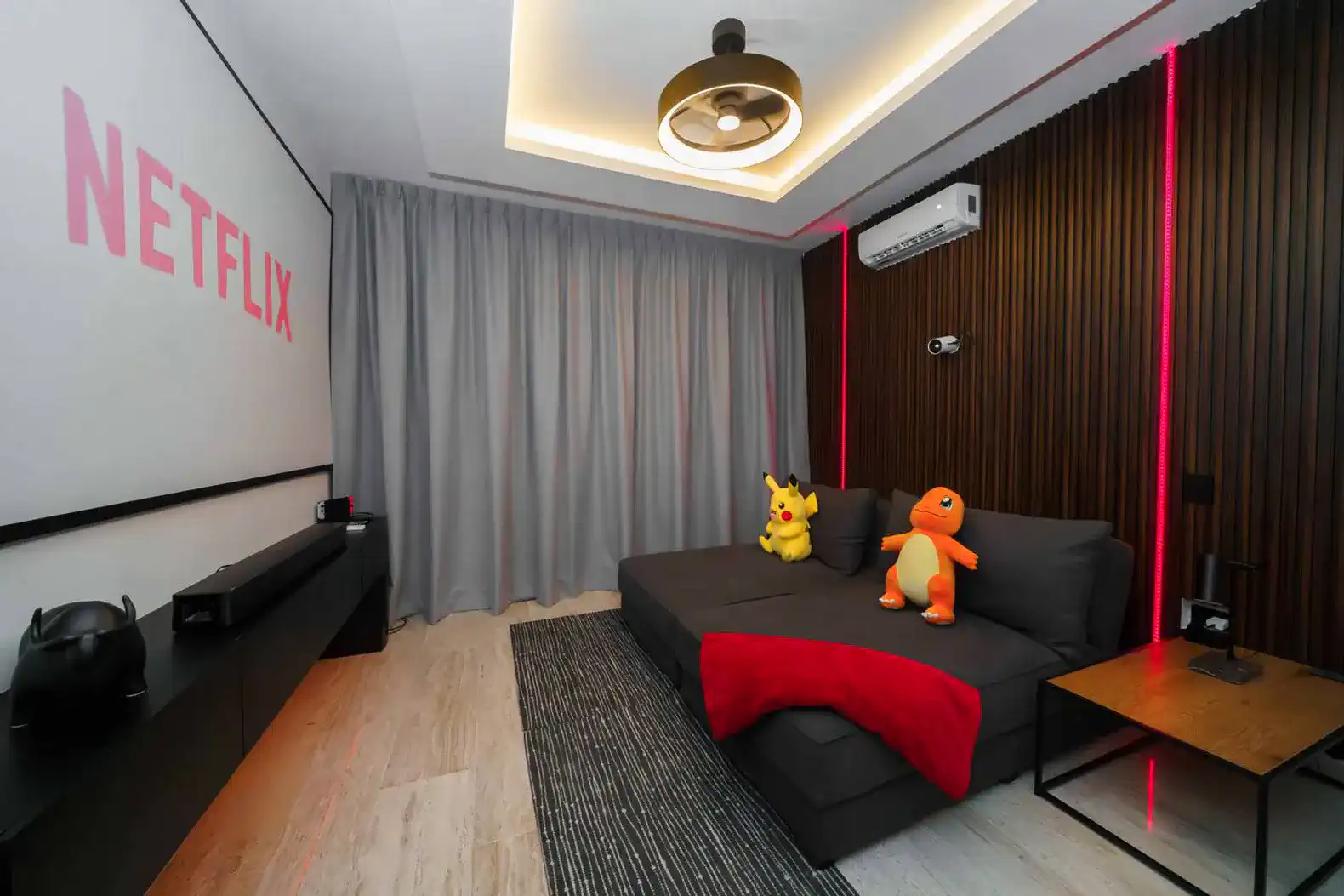 Suite 4: Transform your stay with a private cinema room — 120” screen, two sofa beds, and a full bathroom.