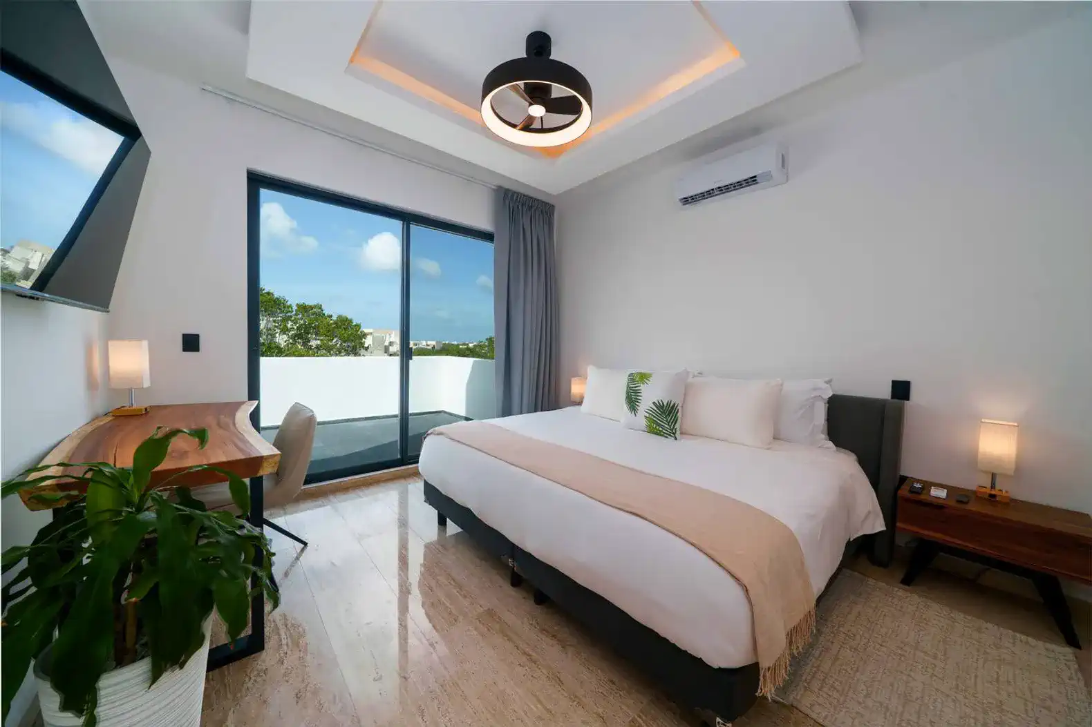 Suite 2: Spacious bedroom with a King bed, private bathroom, and a 55” TV for cozy nights in.