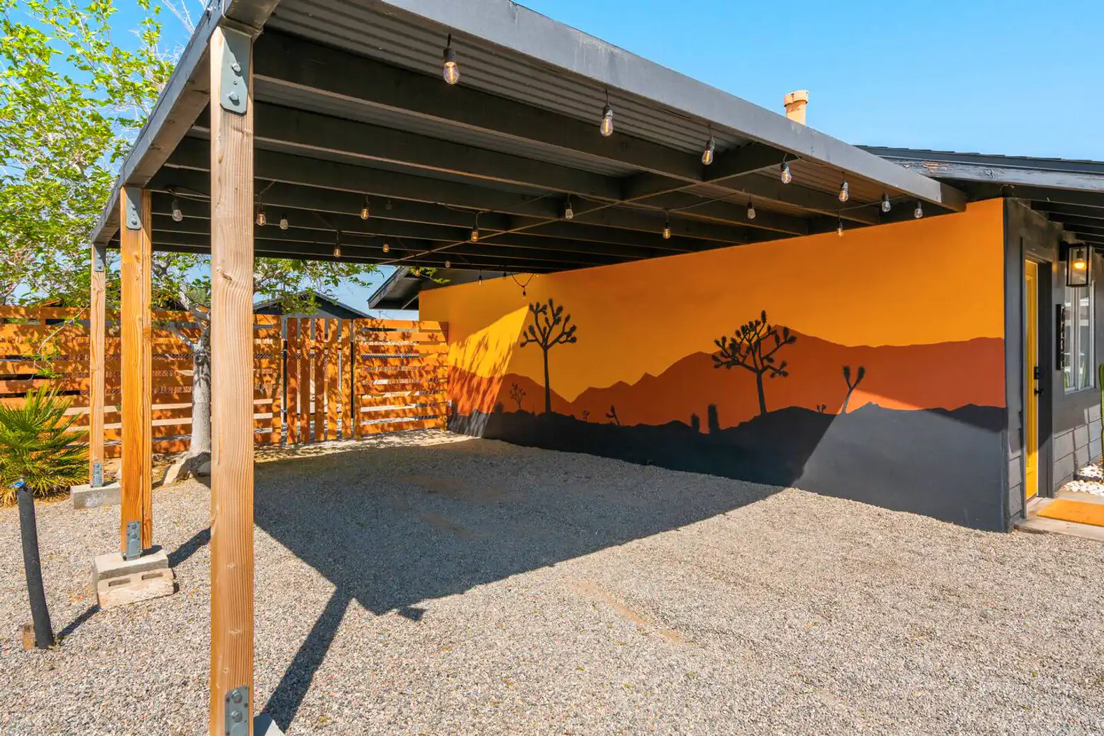 covered carport area and globe lights