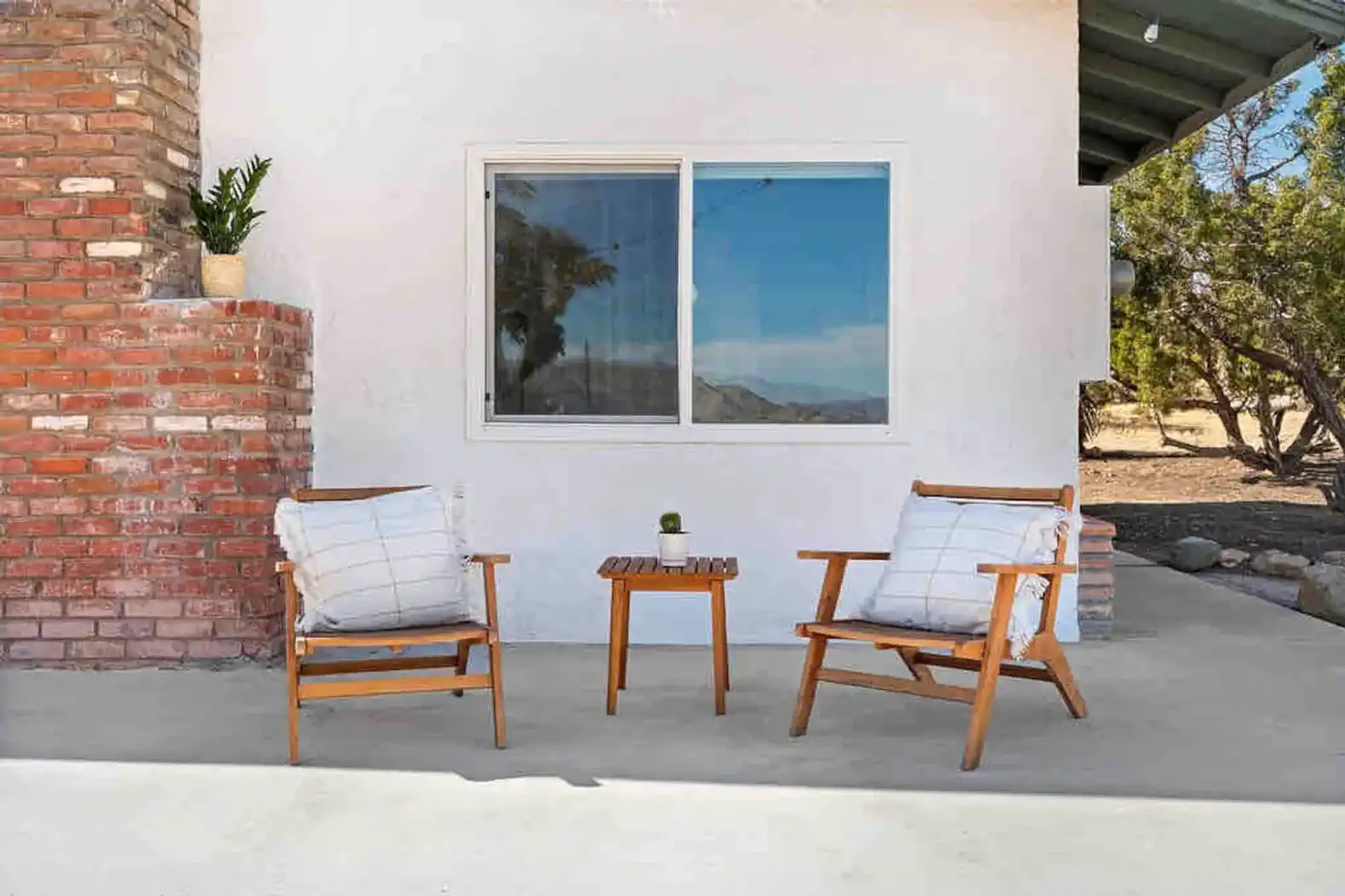 Cozy outdoor seating area with two chairs and a small table