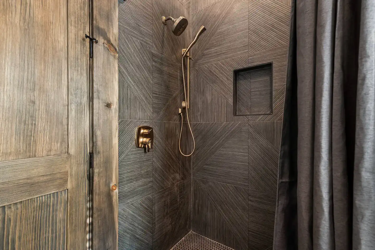 Stylish shower with modern fixtures and textured tile walls