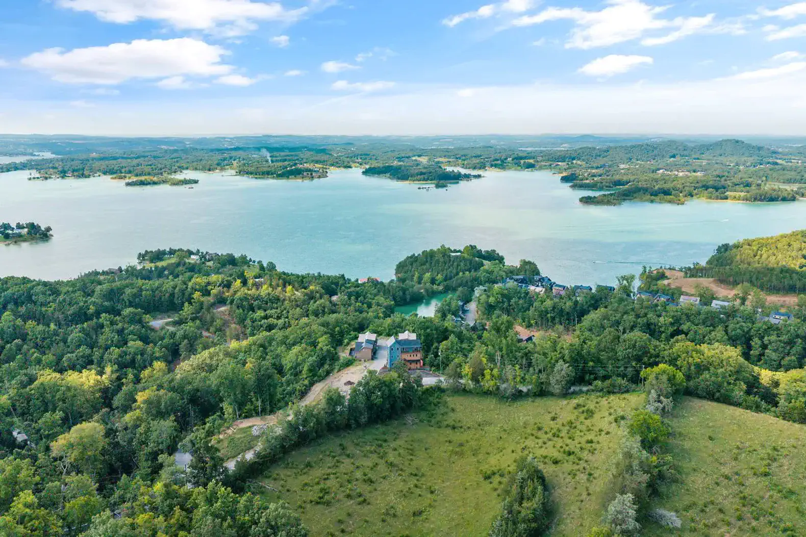 Scenic aerial view of lush greenery and tranquil lake with islands