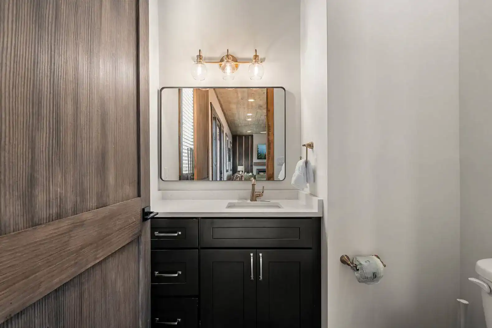 Modern bathroom with stylish fixtures and a large mirror