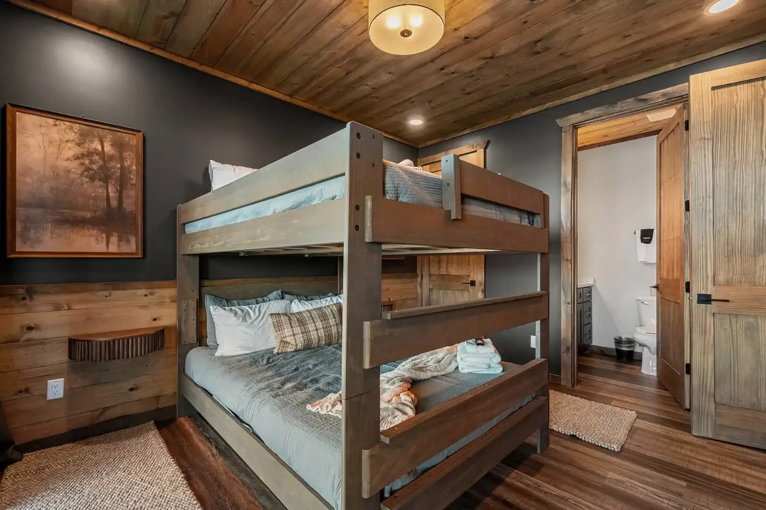 Cozy bunk room with wooden bunk beds and rustic decor