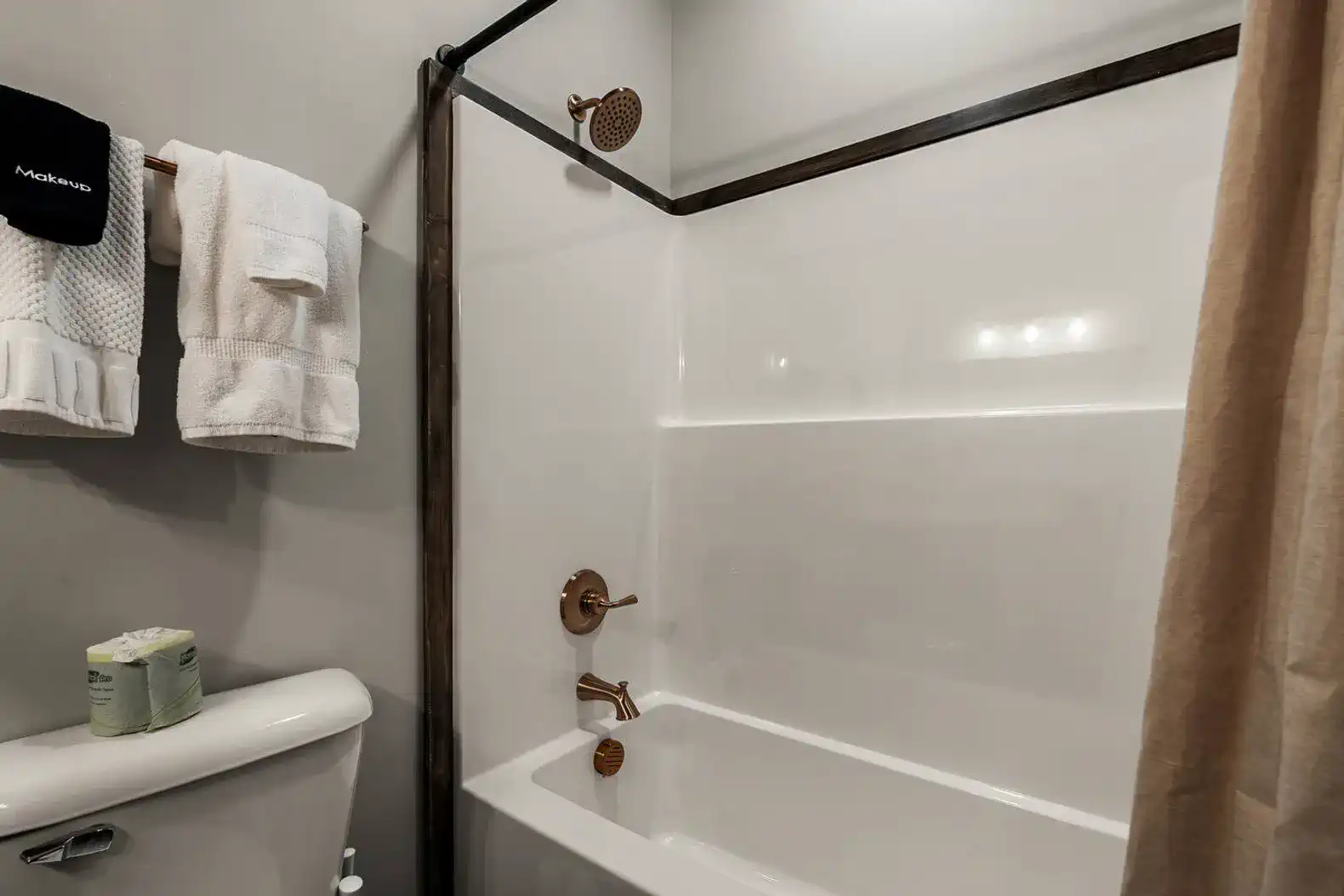 Modern bathroom with a shower-tub combo and stylish fixtures